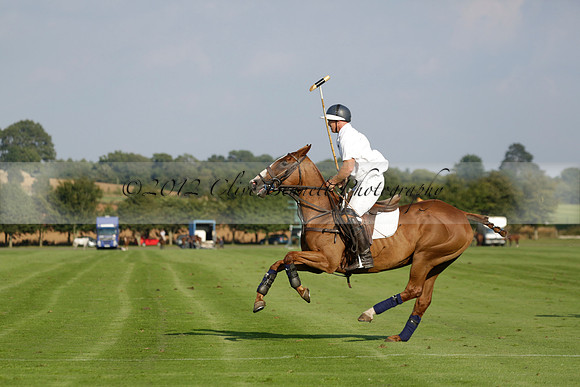 Pluma Negra (white) v Shoreline (black) in the Brecknock Cup Subsidiary final polo match played on Sunday 25 August 2013 at Cowdray Park Polo Club on Ambersham 1. 2013.10.12 www.polopictures.co.uk