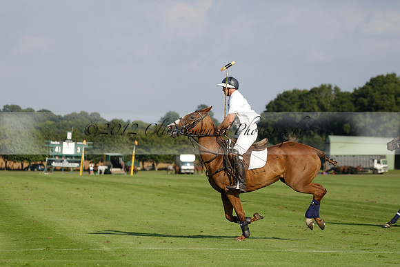 Pluma Negra (white) v Shoreline (black) in the Brecknock Cup Subsidiary final polo match played on Sunday 25 August 2013 at Cowdray Park Polo Club on Ambersham 1. 2013.10.12 www.polopictures.co.uk