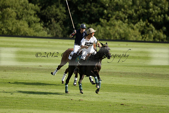 Pandas (white) v Home Farm (navy) in a Park House West Sussex Cup Polo match on Brooksfield at Cowdray Park Polo Club on Friday 30 August 2013. 2013.08.30 www.polopictures.co.uk