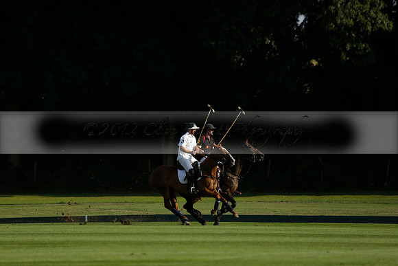 Pluma Negra (white) v Shoreline (black) in the Brecknock Cup Subsidiary final polo match played on Sunday 25 August 2013 at Cowdray Park Polo Club on Ambersham 1. 2013.10.12 www.polopictures.co.uk