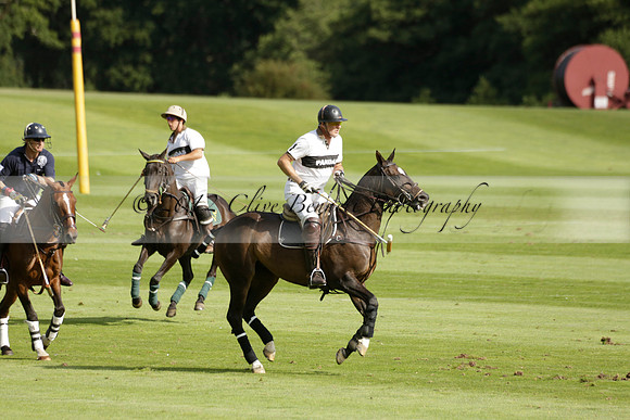 Pandas (white) v Home Farm (navy) in a Park House West Sussex Cup Polo match on Brooksfield at Cowdray Park Polo Club on Friday 30 August 2013. 2013.08.30 www.polopictures.co.uk
