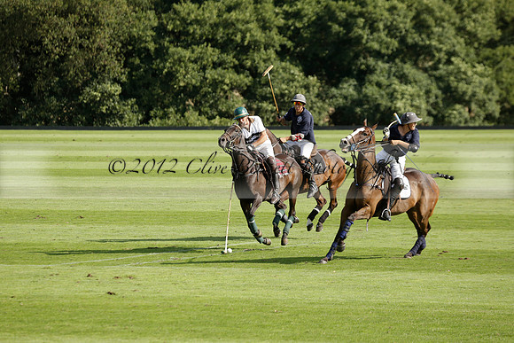 Pandas (white) v Home Farm (navy) in a Park House West Sussex Cup Polo match on Brooksfield at Cowdray Park Polo Club on Friday 30 August 2013. 2013.08.30 www.polopictures.co.uk