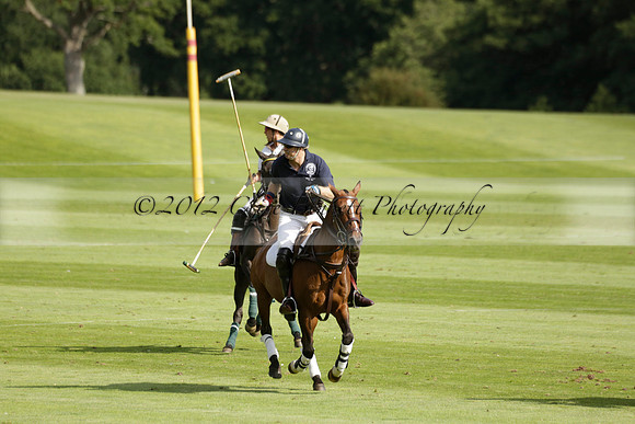 Pandas (white) v Home Farm (navy) in a Park House West Sussex Cup Polo match on Brooksfield at Cowdray Park Polo Club on Friday 30 August 2013. 2013.08.30 www.polopictures.co.uk