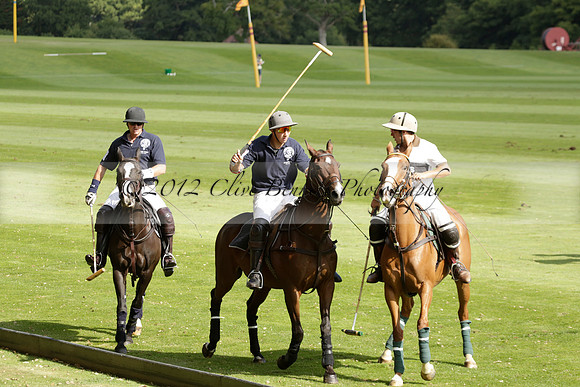 Pandas (white) v Home Farm (navy) in a Park House West Sussex Cup Polo match on Brooksfield at Cowdray Park Polo Club on Friday 30 August 2013. 2013.08.30 www.polopictures.co.uk