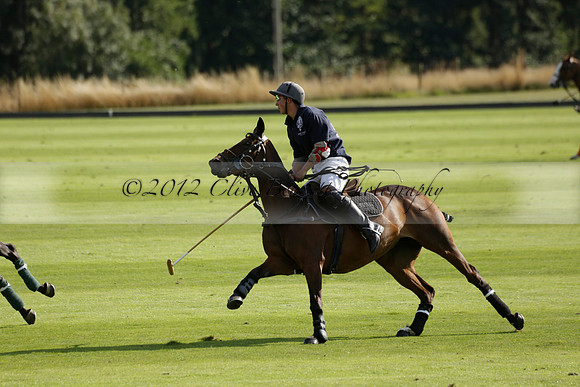 Pandas (white) v Home Farm (navy) in a Park House West Sussex Cup Polo match on Brooksfield at Cowdray Park Polo Club on Friday 30 August 2013. 2013.08.30 www.polopictures.co.uk