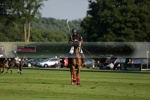 Pluma Negra (white) v Shoreline (black) in the Brecknock Cup Subsidiary final polo match played on Sunday 25 August 2013 at Cowdray Park Polo Club on Ambersham 1. 2013.10.12 www.polopictures.co.uk