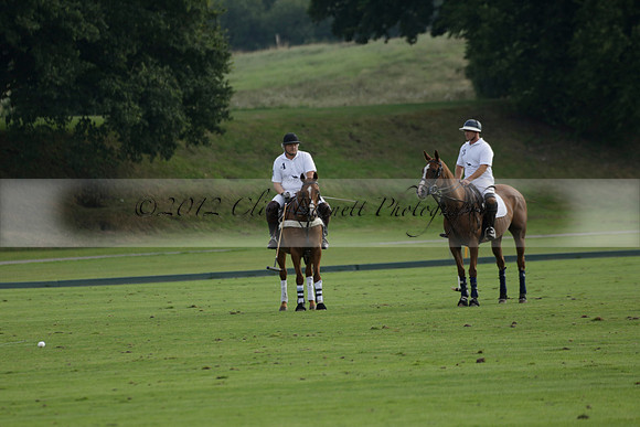 Pluma Negra (white) v Shoreline (black) in the Brecknock Cup Subsidiary final polo match played on Sunday 25 August 2013 at Cowdray Park Polo Club on Ambersham 1. 2013.10.12 www.polopictures.co.uk