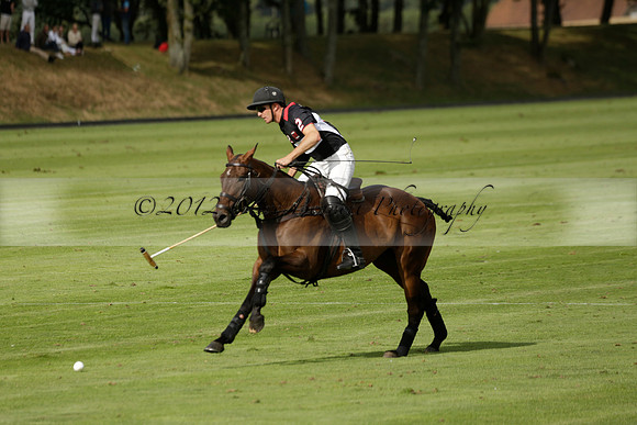 Jaeger Le Coultre (black)  v Wairakei Pastoral (white) in a Jaeger Le Coultre Holden White Cup polo match played on 29 July 2013 at Cowdray Park Polo Club on Brooksfieldwww.polopictures.co.uk