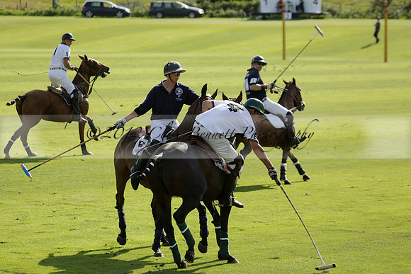 Pandas (white) v Home Farm (navy) in a Park House West Sussex Cup Polo match on Brooksfield at Cowdray Park Polo Club on Friday 30 August 2013. 2013.08.30 www.polopictures.co.uk