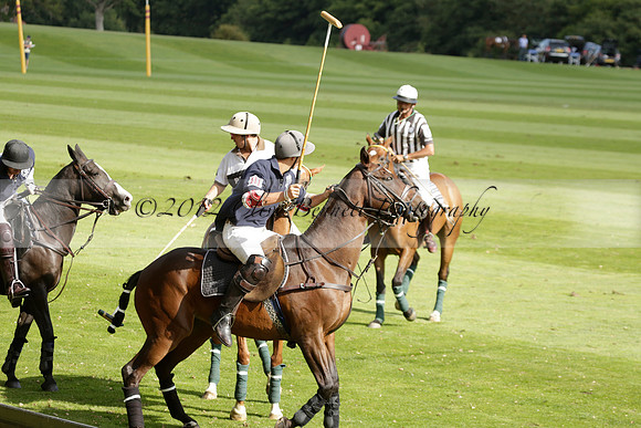 Pandas (white) v Home Farm (navy) in a Park House West Sussex Cup Polo match on Brooksfield at Cowdray Park Polo Club on Friday 30 August 2013. 2013.08.30 www.polopictures.co.uk