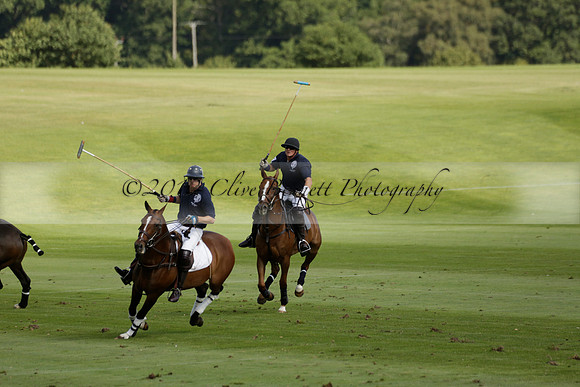 Pandas (white) v Home Farm (navy) in a Park House West Sussex Cup Polo match on Brooksfield at Cowdray Park Polo Club on Friday 30 August 2013. 2013.08.30 www.polopictures.co.uk