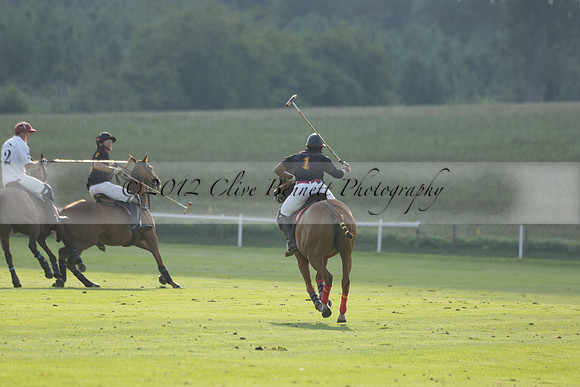 Pluma Negra (white) v Shoreline (black) in the Brecknock Cup Subsidiary final polo match played on Sunday 25 August 2013 at Cowdray Park Polo Club on Ambersham 1. 2013.10.12 www.polopictures.co.uk