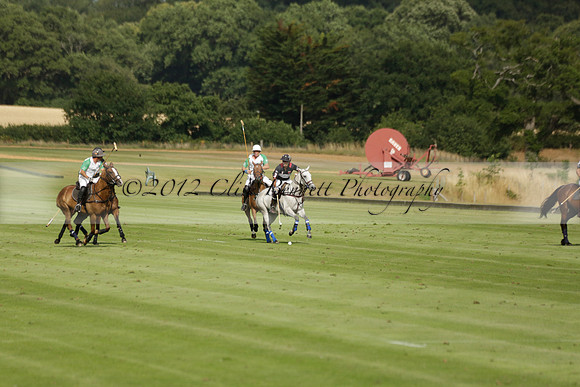 Jaeger Le Coultre (black)  v Wairakei Pastoral (white) in a Jaeger Le Coultre Holden White Cup polo match played on 29 July 2013 at Cowdray Park Polo Club on Brooksfieldwww.polopictures.co.uk