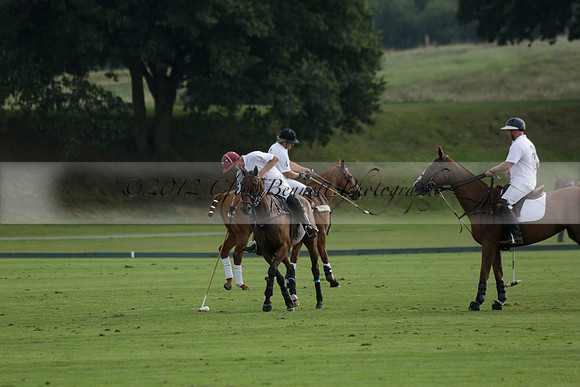 Pluma Negra (white) v Shoreline (black) in the Brecknock Cup Subsidiary final polo match played on Sunday 25 August 2013 at Cowdray Park Polo Club on Ambersham 1. 2013.10.12 www.polopictures.co.uk