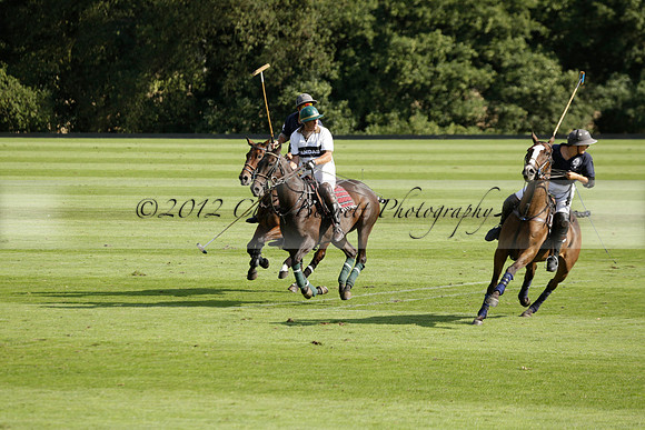 Pandas (white) v Home Farm (navy) in a Park House West Sussex Cup Polo match on Brooksfield at Cowdray Park Polo Club on Friday 30 August 2013. 2013.08.30 www.polopictures.co.uk