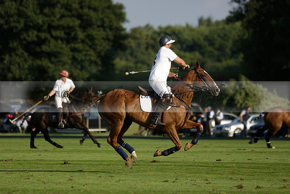 Pluma Negra (white) v Shoreline (black) in the Brecknock Cup Subsidiary final polo match played on Sunday 25 August 2013 at Cowdray Park Polo Club on Ambersham 1. 2013.10.12 www.polopictures.co.uk