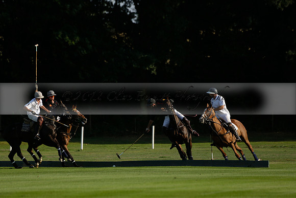 Pluma Negra (white) v Shoreline (black) in the Brecknock Cup Subsidiary final polo match played on Sunday 25 August 2013 at Cowdray Park Polo Club on Ambersham 1. 2013.10.12 www.polopictures.co.uk