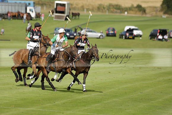 Jaeger Le Coultre (black)  v Wairakei Pastoral (white) in a Jaeger Le Coultre Holden White Cup polo match played on 29 July 2013 at Cowdray Park Polo Club on Brooksfieldwww.polopictures.co.uk