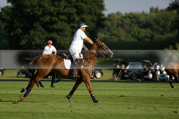 Pluma Negra (white) v Shoreline (black) in the Brecknock Cup Subsidiary final polo match played on Sunday 25 August 2013 at Cowdray Park Polo Club on Ambersham 1. 2013.10.12 www.polopictures.co.uk