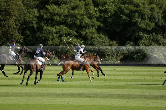 Pandas (white) v Home Farm (navy) in a Park House West Sussex Cup Polo match on Brooksfield at Cowdray Park Polo Club on Friday 30 August 2013. 2013.08.30 www.polopictures.co.uk