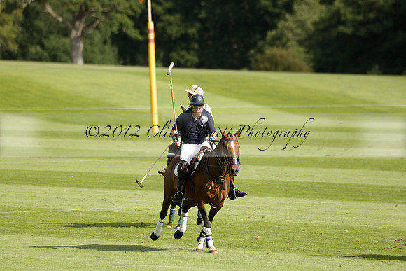 Pandas (white) v Home Farm (navy) in a Park House West Sussex Cup Polo match on Brooksfield at Cowdray Park Polo Club on Friday 30 August 2013. 2013.08.30 www.polopictures.co.uk