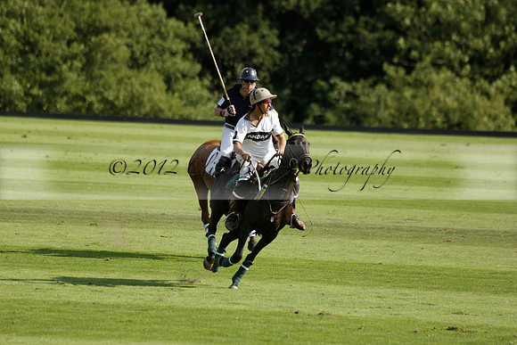 Pandas (white) v Home Farm (navy) in a Park House West Sussex Cup Polo match on Brooksfield at Cowdray Park Polo Club on Friday 30 August 2013. 2013.08.30 www.polopictures.co.uk