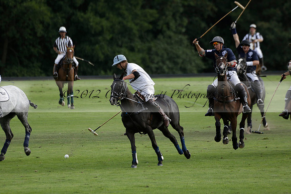 Pandas (white) v Home Farm (navy) in a Park House West Sussex Cup Polo match on Brooksfield at Cowdray Park Polo Club on Friday 30 August 2013. 2013.08.30 www.polopictures.co.uk