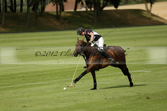 Jaeger Le Coultre (black)  v Wairakei Pastoral (white) in a Jaeger Le Coultre Holden White Cup polo match played on 29 July 2013 at Cowdray Park Polo Club on Brooksfieldwww.polopictures.co.uk