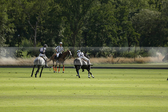 Pandas (white) v Home Farm (navy) in a Park House West Sussex Cup Polo match on Brooksfield at Cowdray Park Polo Club on Friday 30 August 2013. 2013.08.30 www.polopictures.co.uk