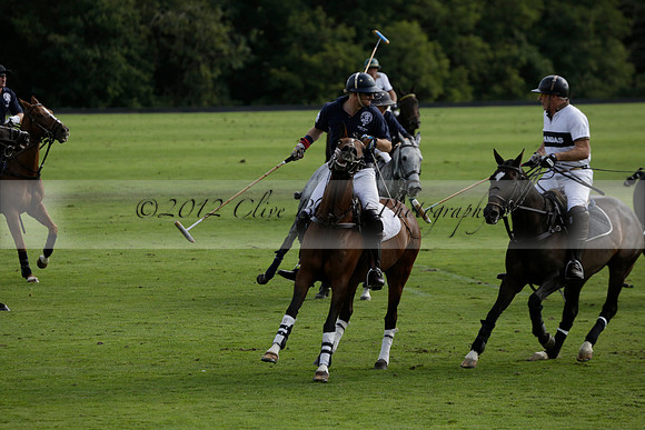 Pandas (white) v Home Farm (navy) in a Park House West Sussex Cup Polo match on Brooksfield at Cowdray Park Polo Club on Friday 30 August 2013. 2013.08.30 www.polopictures.co.uk