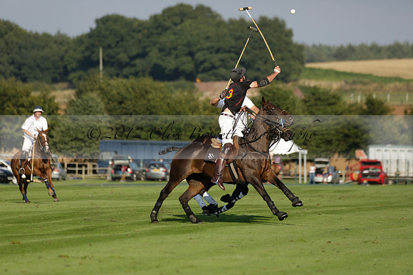 Pluma Negra (white) v Shoreline (black) in the Brecknock Cup Subsidiary final polo match played on Sunday 25 August 2013 at Cowdray Park Polo Club on Ambersham 1. 2013.10.12 www.polopictures.co.uk