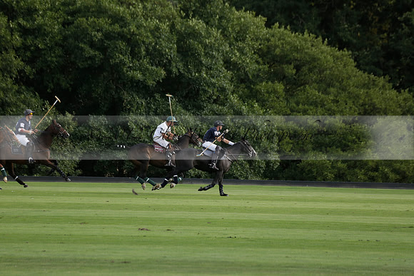 Pandas (white) v Home Farm (navy) in a Park House West Sussex Cup Polo match on Brooksfield at Cowdray Park Polo Club on Friday 30 August 2013. 2013.08.30 www.polopictures.co.uk