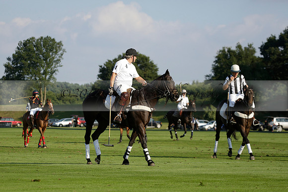 Pluma Negra (white) v Shoreline (black) in the Brecknock Cup Subsidiary final polo match played on Sunday 25 August 2013 at Cowdray Park Polo Club on Ambersham 1. 2013.10.12 www.polopictures.co.uk