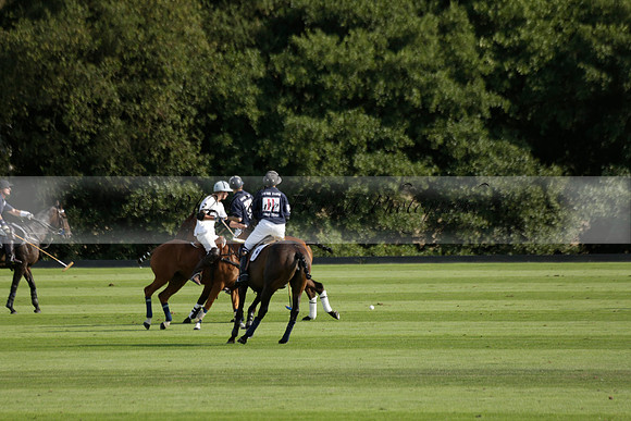 Pandas (white) v Home Farm (navy) in a Park House West Sussex Cup Polo match on Brooksfield at Cowdray Park Polo Club on Friday 30 August 2013. 2013.08.30 www.polopictures.co.uk