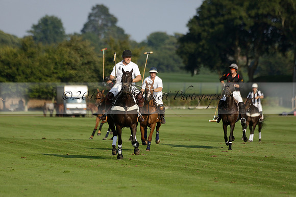 Pluma Negra (white) v Shoreline (black) in the Brecknock Cup Subsidiary final polo match played on Sunday 25 August 2013 at Cowdray Park Polo Club on Ambersham 1. 2013.10.12 www.polopictures.co.uk