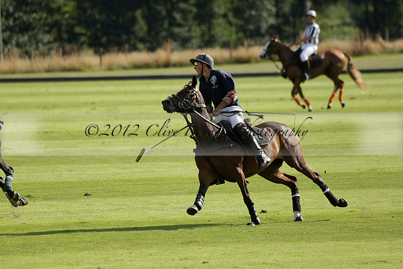 Pandas (white) v Home Farm (navy) in a Park House West Sussex Cup Polo match on Brooksfield at Cowdray Park Polo Club on Friday 30 August 2013. 2013.08.30 www.polopictures.co.uk
