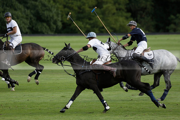 Pandas (white) v Home Farm (navy) in a Park House West Sussex Cup Polo match on Brooksfield at Cowdray Park Polo Club on Friday 30 August 2013. 2013.08.30 www.polopictures.co.uk