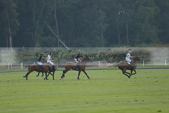 Pluma Negra (white) v Shoreline (black) in the Brecknock Cup Subsidiary final polo match played on Sunday 25 August 2013 at Cowdray Park Polo Club on Ambersham 1. 2013.10.12 www.polopictures.co.uk