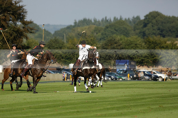 Pluma Negra (white) v Shoreline (black) in the Brecknock Cup Subsidiary final polo match played on Sunday 25 August 2013 at Cowdray Park Polo Club on Ambersham 1. 2013.10.12 www.polopictures.co.uk