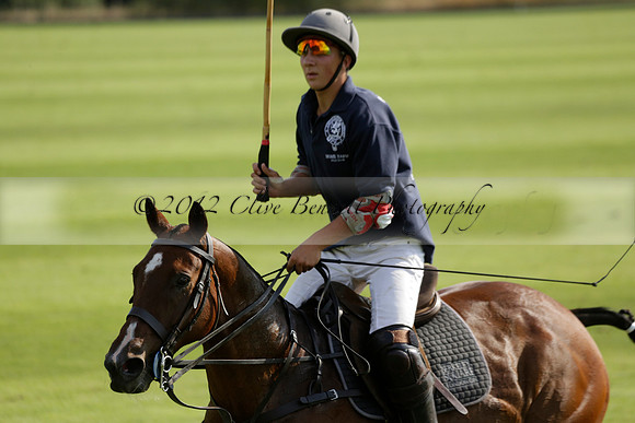 Pandas (white) v Home Farm (navy) in a Park House West Sussex Cup Polo match on Brooksfield at Cowdray Park Polo Club on Friday 30 August 2013. 2013.08.30 www.polopictures.co.uk
