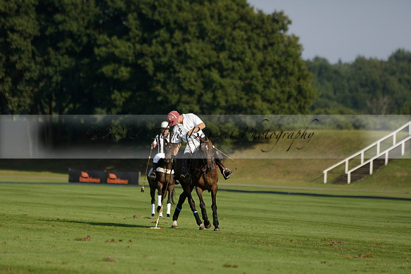 Pluma Negra (white) v Shoreline (black) in the Brecknock Cup Subsidiary final polo match played on Sunday 25 August 2013 at Cowdray Park Polo Club on Ambersham 1. 2013.10.12 www.polopictures.co.uk