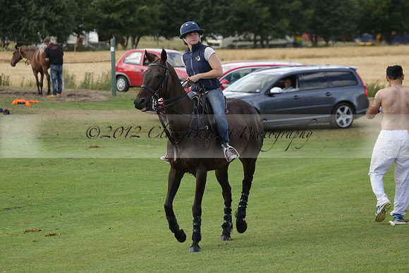 Jaeger Le Coultre (black)  v Wairakei Pastoral (white) in a Jaeger Le Coultre Holden White Cup polo match played on 29 July 2013 at Cowdray Park Polo Club on Brooksfieldwww.polopictures.co.uk