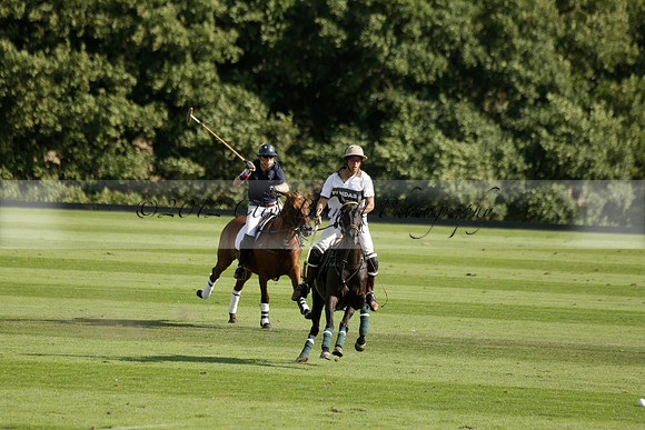 Pandas (white) v Home Farm (navy) in a Park House West Sussex Cup Polo match on Brooksfield at Cowdray Park Polo Club on Friday 30 August 2013. 2013.08.30 www.polopictures.co.uk