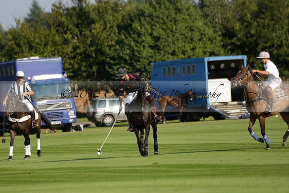 Pluma Negra (white) v Shoreline (black) in the Brecknock Cup Subsidiary final polo match played on Sunday 25 August 2013 at Cowdray Park Polo Club on Ambersham 1. 2013.10.12 www.polopictures.co.uk