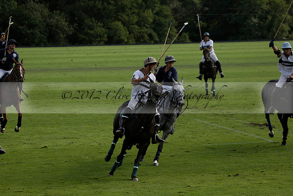 Pandas (white) v Home Farm (navy) in a Park House West Sussex Cup Polo match on Brooksfield at Cowdray Park Polo Club on Friday 30 August 2013. 2013.08.30 www.polopictures.co.uk
