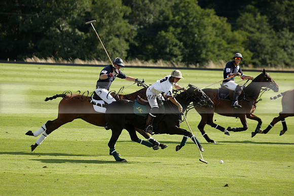 Pandas (white) v Home Farm (navy) in a Park House West Sussex Cup Polo match on Brooksfield at Cowdray Park Polo Club on Friday 30 August 2013. 2013.08.30 www.polopictures.co.uk