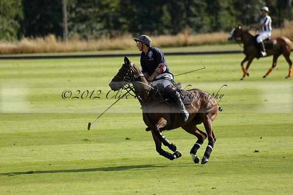 Pandas (white) v Home Farm (navy) in a Park House West Sussex Cup Polo match on Brooksfield at Cowdray Park Polo Club on Friday 30 August 2013. 2013.08.30 www.polopictures.co.uk