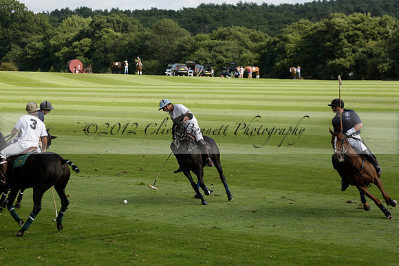 Pandas (white) v Home Farm (navy) in a Park House West Sussex Cup Polo match on Brooksfield at Cowdray Park Polo Club on Friday 30 August 2013. 2013.08.30 www.polopictures.co.uk