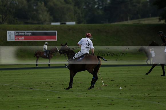 Pluma Negra (white) v Shoreline (black) in the Brecknock Cup Subsidiary final polo match played on Sunday 25 August 2013 at Cowdray Park Polo Club on Ambersham 1. 2013.10.12 www.polopictures.co.uk