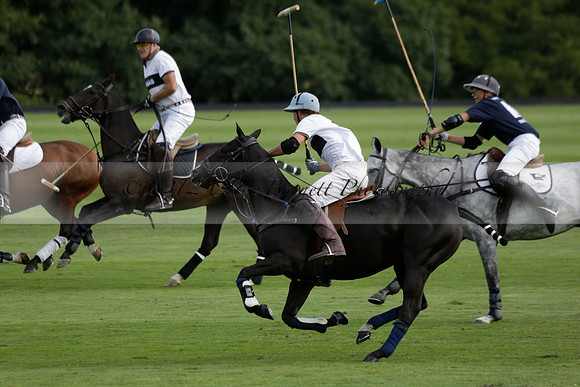 Pandas (white) v Home Farm (navy) in a Park House West Sussex Cup Polo match on Brooksfield at Cowdray Park Polo Club on Friday 30 August 2013. 2013.08.30 www.polopictures.co.uk